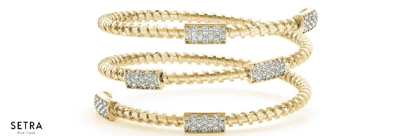 FINE 14K GOLD OPEN TWIST BANGLE DIAMOND BRACELET